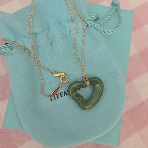 Tiffany & Co. Jade heart, 18 karat gold chain.